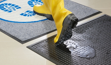 Sistema de alfombras desinfectantes